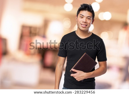 chinese man holding a book