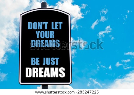 DO  NOT LET YOUR DREAMS BE JUST DREAMS motivational quote written on road sign isolated over clear blue sky background with available copy space. Concept  image