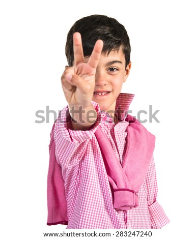 Child doing victory gesture 