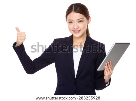 Asian businesswoman hold with tablet and thumb up
