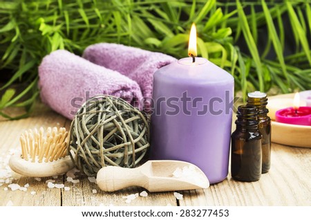 Spa Care with Essence Bottle,Sea Salt and Scent Candle on Wellness Background 