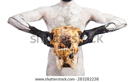 Primitive man holding veal skull