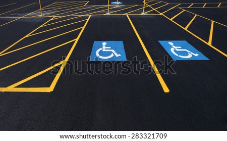 The international markings for a handicapped parking stall in a parking lot.
