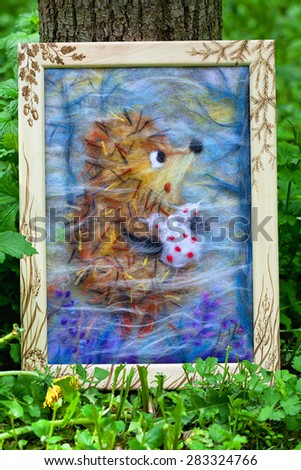 Contemporary art - felting wool, handmade. The painting depicts the hedgehog in the forest. The picture is created from natural wool fibers of different colors.