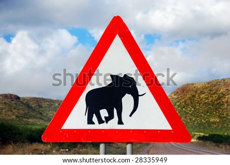 Road sign to warn about elephant in the road