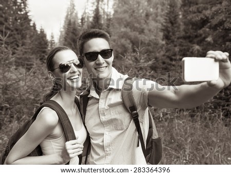 Happy couple taking photo. 