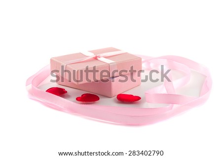 Gift box with a pink ribbon and red hearts and a large pink ribbon on a white background