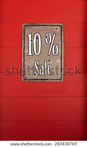 10 percentage sale billboards on red wood background