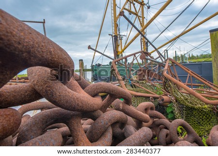 big rusty chain with fishing cutter
