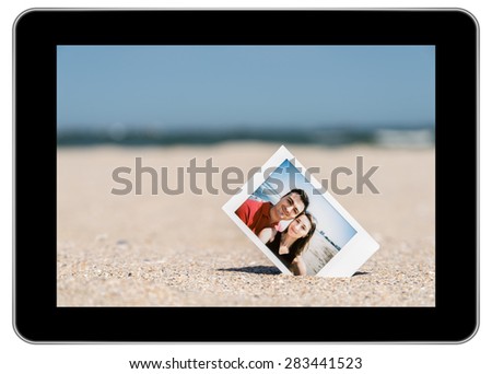 Instant Photo Of Young Couple On Beach On Modern Black Tablet In iPad Style