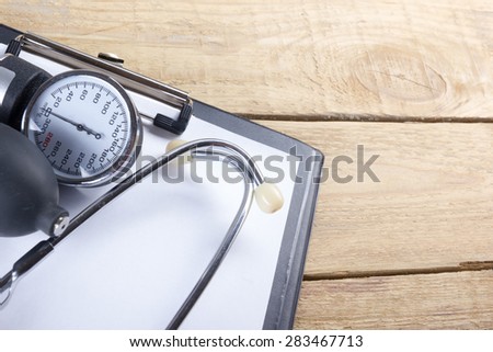 Financial analysis, audit or accounting - Stethoscope over a calculator and dollar bills. Medical costs, financial concept