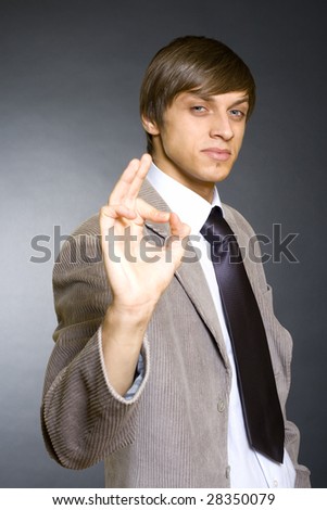 Young Businessmen making his ok sign