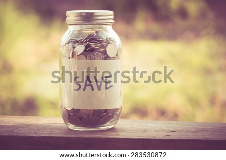 money in the glass with filter effect retro vintage style Royalty-Free Stock Photo #283530872