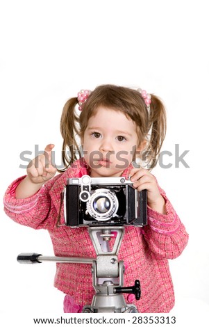 Attractive little girl with photo camera over white