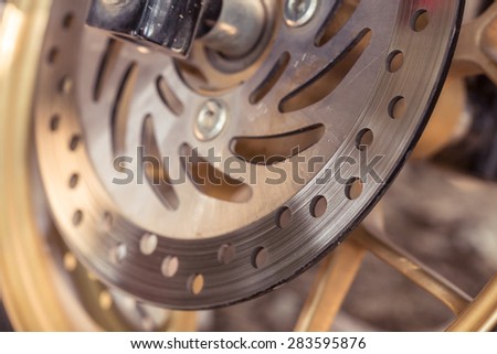 detail of motorcycle disc brakes, close up image