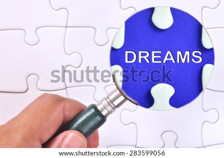Searching for missing "Dreams" word puzzle using the magnifying glass 