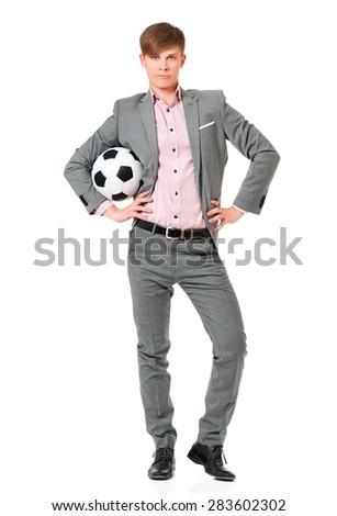 Young man in suit with soccer ball, isolated on white background