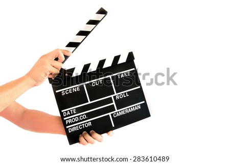 Hand holding a movie director scene card on white background.