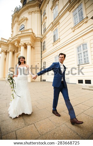 gentle stylish couple on a background of the beautiful old castle