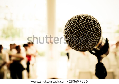 Microphone in seminar event defocus on person background. Vintage style