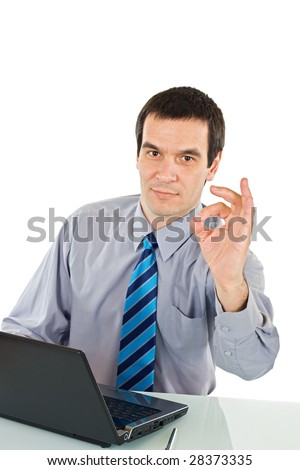 Businessman with laptop showing ok sign - isolated