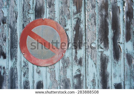 no parking sign on grungy garage door background