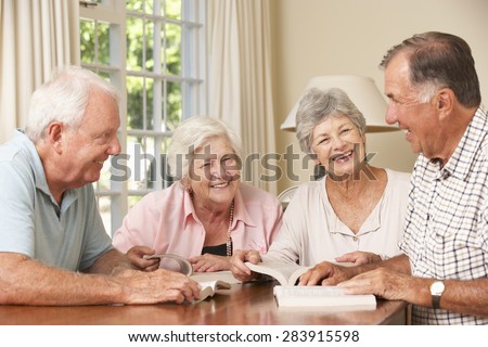 Group Of Senior Couples Attending Book Reading Group Royalty-Free Stock Photo #283915598