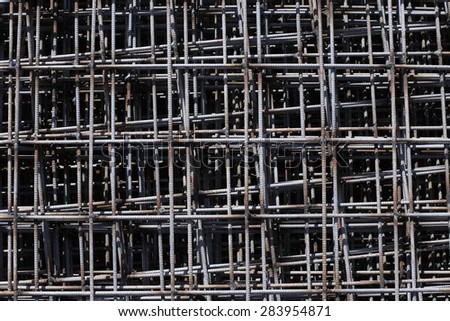 Pattern from stack of rebar grids at the construction site. Top view
