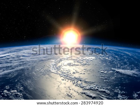 Earth with the rising sun. Elements of this image furnished by NASA