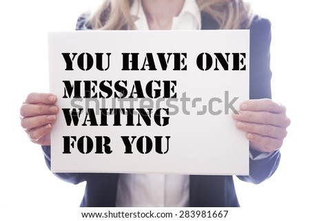Young businesswoman behind white board with text  you have one message waiting for you   on white background
