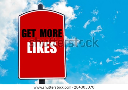 Get More Likes  motivational quote written on red road sign isolated over clear blue sky background. Concept  image with available copy space