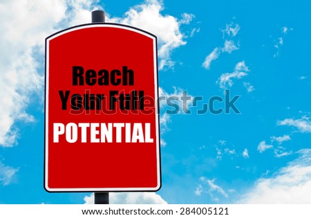 Reach Your Full Potential motivational quote written on red road sign isolated over clear blue sky background. Concept  image with available copy space