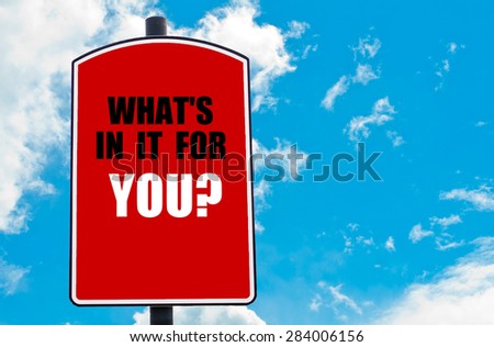 What Is In It For You? motivational quote written on red road sign isolated over clear blue sky background. Concept  image with available copy space