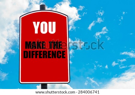 You Make The Difference motivational quote written on red road sign isolated over clear blue sky background. Concept  image with available copy space