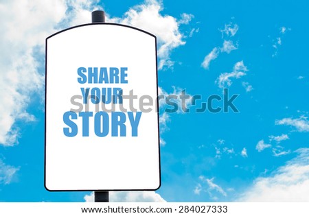 Share your Story motivational quote written on white road sign isolated over clear blue sky background. Concept  image with available copy space