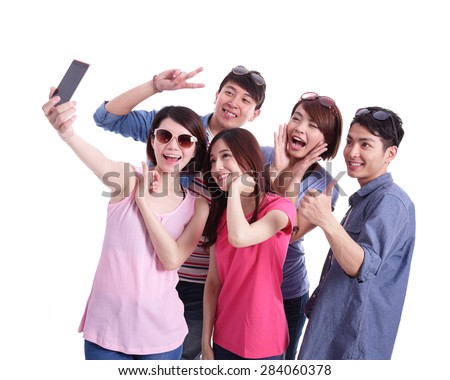 Selfie - Happy teenagers taking pictures by themselves isolated on white background, asian