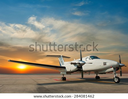 Propeller plane parking at the airport Royalty-Free Stock Photo #284081462