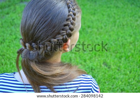 Hairstyle with a French braid Royalty-Free Stock Photo #284098142