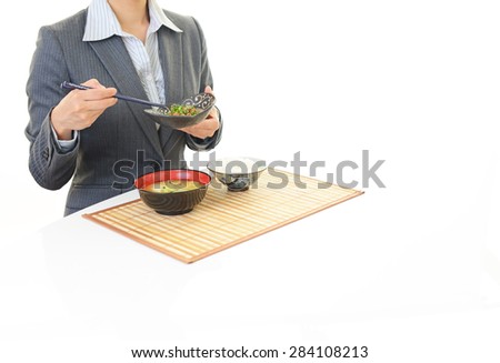 Businesswoman eating a meal