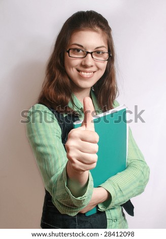 All is excellent. Portrait of the girl with the hand extended forward and lifted upwards thumb.