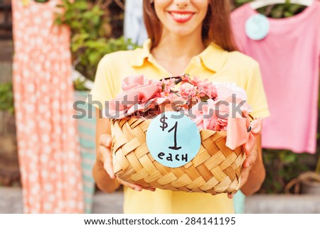 woman selling things on a garage sale 