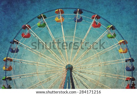 Vintage grunge background with colorful ferris wheel Royalty-Free Stock Photo #284171216