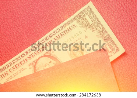 Dollar bill lying in the cover 