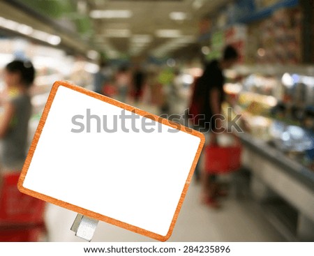 blank blackboard in supermarket in blurry for background