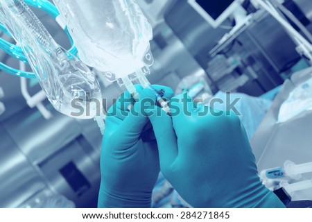 Doctor prepares operating room to the beginning of surgery Royalty-Free Stock Photo #284271845