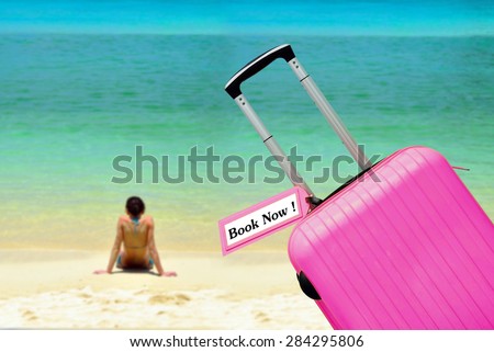 Book Now. suitcase with label at sea.