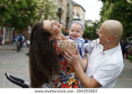 a Beautiful happy young family with baby