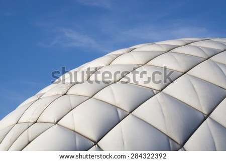 Dome of a inflatable tennis court on a background of blue sky Royalty-Free Stock Photo #284322392