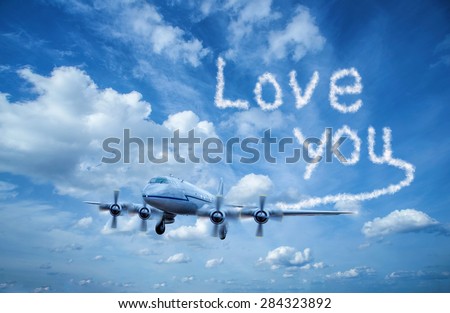 Airplane writes with smoke love you