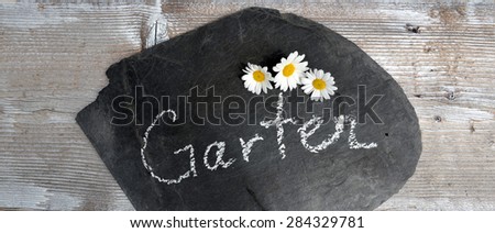 blackboard with the german words "Garten" /  garden